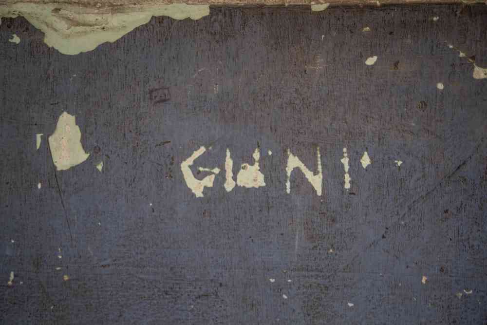 Prisoner name on a wall